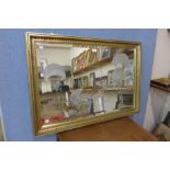 A gilt framed mirror