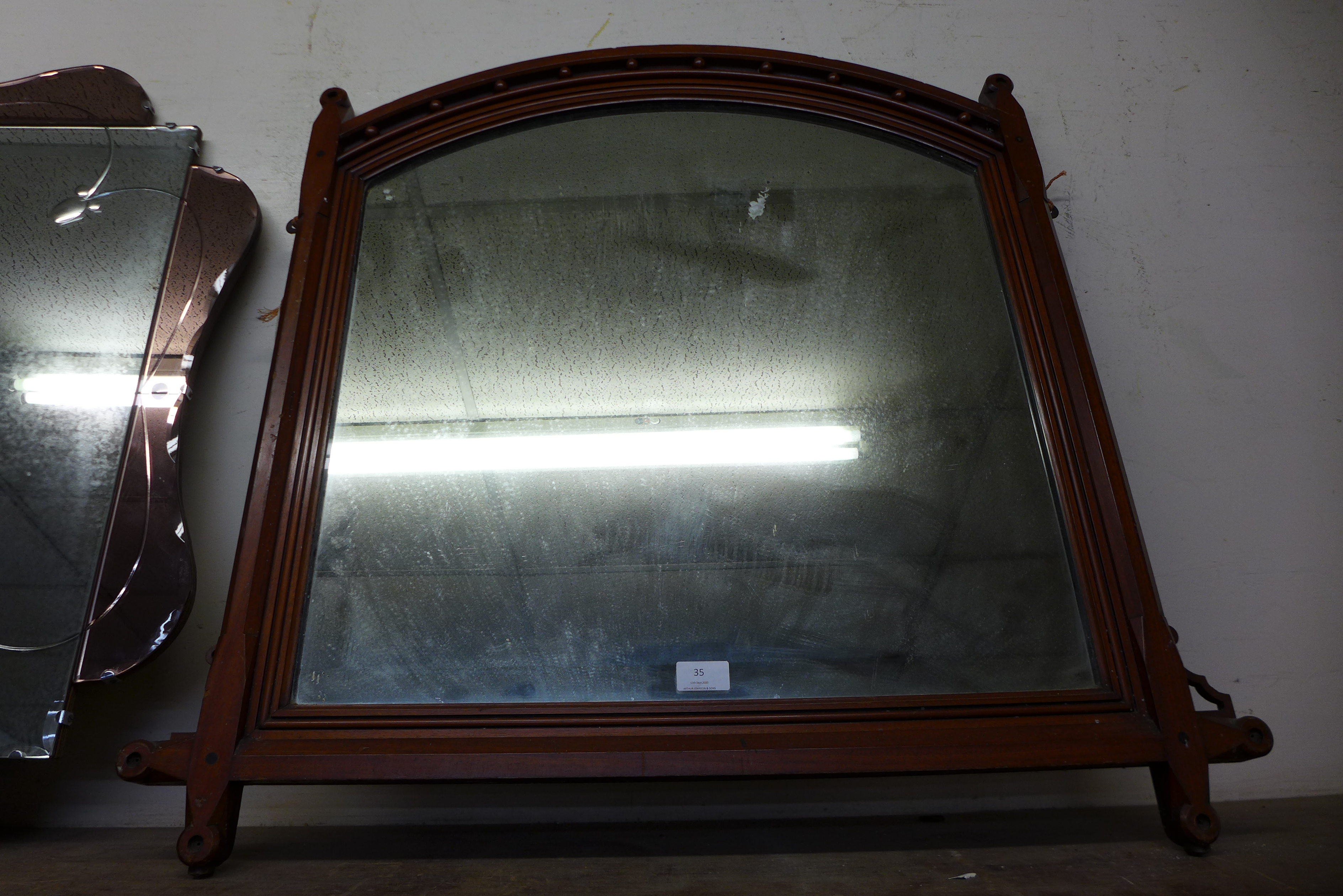 A Victorian Aesthetic Movement walnut overmantel mirror