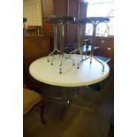 A 1970's chrome based table, three chairs and four stools