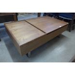 A simulated oak and chrome metamorphic coffee table