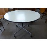 A Herman Miller style steel based circular table