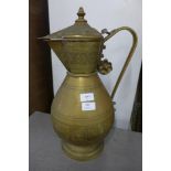 An Islamic brass ewer