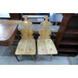 A pair of Cepelia carved oak hall chairs