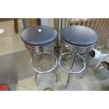 A pair of chrome bar stools