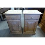 A pair of pine bedside cupboards