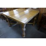 An oak draw-leaf table