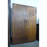 A large beech two door school cupboard