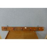 A pine and metal coat rack