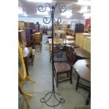 A wrought iron coat stand