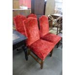 A set of four 18th Century style oak and red fabric upholstered dining chairs, originally