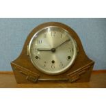 An Art Deco oak mantel clock