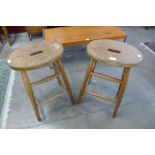 A pair of Victorian elm and beech stools