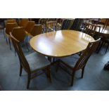 A William Lawrence teak extending dining table and four chairs