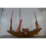A wooden model of an oriental junk