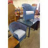 A Lloyd Loom blue wicker table and two chairs
