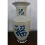 An oriental style porcelain vase, 53cms h