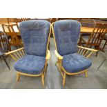 A pair of Ercol Blonde highback Windsor armchairs