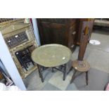 A mahogany spinning stool and a brass topped folding occasional table