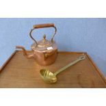 A Victorian copper kettle and a large brass ladle