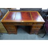 A yew wood pedestal desk