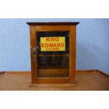 A small oak smokes cabinet, bearing King Edward Cigars inscription to door 29cms h x 23cms w