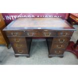 A small George III mahogany pedestal desk, 69cms h, 103cms w, 59cms d