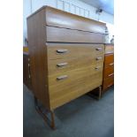 A teak chest of drawers