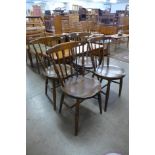 A set of four Victorian elm and beech kitchen chairs