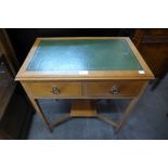 An inlaid mahogany two drawer writing table