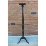 A Hepplewhite Revival carved mahogany torchere, 142cms h