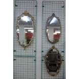 Three gilt framed oval mirrors