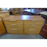 A teak chest of drawers