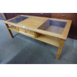 A teak and glass topped coffee table