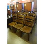 A set of six oak ladderback dining chairs