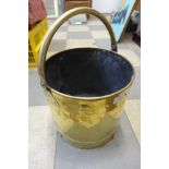 An Arts and Crafts brass coal bucket