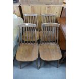 A set of four beech stickback chairs