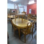 A Nathan teak extending dining table and five chairs