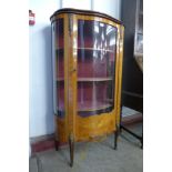 A French Louis XV style inlaid mahogany and gilt metal mounted serpentine vitrine, 140cms h, 81cms