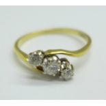 An 18ct gold, three stone diamond trilogy ring, 2.7g, R