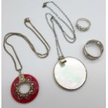 Two silver rings and two silver mounted pendants and chains