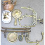 A pair of brass electric light wall sconces, a copper kettle, brass ornaments, etc.