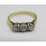 A yellow metal, three stone diamond ring, 2.6g, L