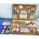 A canteen of cutlery, a set of six plated knives and forks, a cased set of six plated spoons with