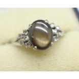 A white metal, cats eye and diamond set ring, marked 18k, 5.4g, V