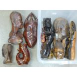 A collection of tourist carved wooden masks and bust **PLEASE NOTE THIS LOT IS NOT ELIGIBLE FOR