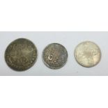 A George II 1757 sixpence, a William III shilling and a George III 1816 sixpence