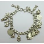 A white metal charm bracelet, 50g