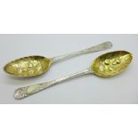 A pair of George III silver berry spoons and gilded bowls, London 1764, 129g