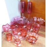 A collection of cranberry glass