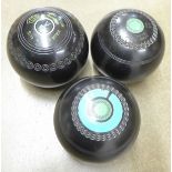 Three bowling woods including one Taylor **PLEASE NOTE THIS LOT IS NOT ELIGIBLE FOR POSTING AND